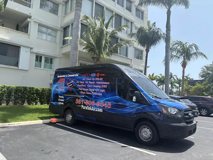 Pure Tek Air branded Ford Transit service van parked in a South Florida lot